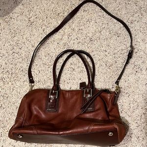 Large brown Coach bag with pink interior